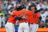 Detroit Tigers' James Outman, right, celebrates his three-run home run with Matt Vierling (8) and Zach McKinstry (39) against the Houston Astros during the fourth inning of a baseball game Friday, June 26, 2026, in Detroit. (AP Photo/Paul Sancya)