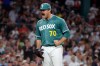 Boston Red Sox starting pitcher Payton Tolle reacts after getting the third out during the seventh inning of a baseball game against the New York Yankees, Friday, June 26, 2026, in Boston. (AP Photo/Mary Schwalm)