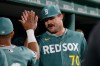 Boston Red Sox starting pitcher Payton Tolle (70) is congratulated by teammates in the dugout after the seventh inning of a baseball game against the New York Yankees, Friday, June 26, 2026, in Boston. (AP Photo/Mary Schwalm)