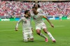 Spain's Alex Baena, left, is congratulated after scoring his side's opening goal by Rodri during the World Cup Group H soccer match between Uruguay and Spain in Zapopan, near Guadalajara, Mexico, Friday, June 26, 2026. (AP Photo/Natacha Pisarenko)