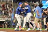 Minnesota Twins' Royce Lewis, left, celebrates with Kody Clemens (2) after hitting a walkoff single against the Colorado Rockies during the 10th inning of a baseball game Friday, June 26 2026, in Minneapolis. (AP Photo/Craig Lassig)