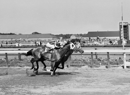 FILE - Seabiscuit leads local horse Aneroid by a nose in the Brooklyn Handicap at the Aqueduct race track in New York on June 26, 1937. (AP Photo/Joe Caneva, File)