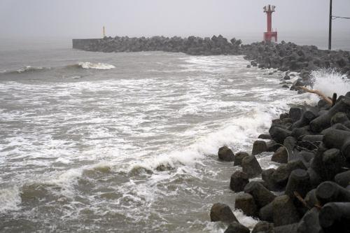 A coastline is hit by high waves as a typhoon approaches Futtsu city, Chiba prefecture near Tokyo, Saturday, June 27, 2026. (Kyodo News via AP)