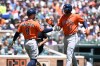 Houston Astros' Christian Walker (8) greets Cam Smith (11) at home plate after Smith hit a two-run home run against the Detroit Tigers in the second inning of a baseball game, Saturday, June 27, 2026, in Detroit. (AP Photo/Lon Horwedel)
