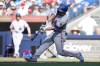 Texas Rangers' Corey Seager (5) hits a solo home run during sixth inning American League MLB baseball action against the Toronto Blue Jays, in Toronto, Saturday, June 27, 2026. THE CANADIAN PRESS/Nathan Denette