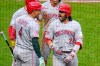 Cincinnati Reds' Eugenio Suárez (28) celebrates with Noelvi Marte (4) as he returns to the dugout after hitting a three-run home run off Pittsburgh Pirates pitcher Gregory Soto during the ninth inning of a baseball game in Pittsburgh, Saturday, June 27, 2026. (AP Photo/Gene J. Puskar)