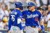 Los Angeles Dodgers' Dalton Rushing (68) celebrates after his solo home run with Alex Freeland (76) in the sixth inning of a baseball game against the San Diego Padres, Saturday, June 27, 2026, in San Diego. (AP Photo/Tony Ding)