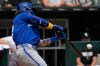 Kansas City Royals' Carter Jensen hits a one-run single during the first inning of a baseball game against the Chicago White Sox in Chicago, Sunday, June 28, 2026. (AP Photo/Nam Y. Huh)
