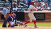 Philadelphia Phillies' Kyle Schwarber, right, watches his two-run home run against the New York Mets during the seventh inning of a baseball game, Sunday, June 28, 2026, in New York. (AP Photo/Noah K. Murray)