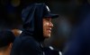 New York Yankees' Aaron Judge smiles in the dugout during the eighth inning of a baseball game against the Cincinnati Reds, Friday, June 19, 2026, in New York. (AP Photo/Noah K. Murray)
