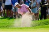 Scottie Scheffler hits out of a bunker at the fifth hole during the final round of the Travelers Championship golf tournament at TPC River Highlands, Sunday, June 28, 2026, in Cromwell, Conn. (AP Photo/Jessica Hill)