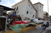 A boy sleeps outside earthquake-damaged homes in Catia La Mar, Venezuela, Sunday, June 28, 2026. (AP Photo/Pedro Mattey)