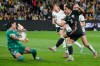 Mexico's goalkeeper Esthefanny Torres, left, blocks a shot from Australia's Sam Kerr during their women's soccer friendly international in Sydney, Tuesday, June 9, 2026. (AP Photo/Rick Rycroft)