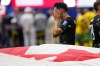 Canada's Stephen Eustáquio (7) reacts as the Canada flag is carried around after defeating South Africa during second half World Cup Round of 32 soccer, in Los Angeles, on Sunday, June 28, 2026. THE CANADIAN PRESS/Frank Gunn