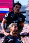Paraguay's Julio Enciso (19) celebrates after scoring his side's opening goal with Gustavo Gomez (15), top, during the World Cup round of 32 soccer match between Germany and Paraguay in Foxborough, Mass., near Boston, Monday, June 29, 2026. (AP Photo/Petr David Josek)