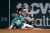 New York Yankees second baseman Jazz Chisholm Jr., right, gets an out against a steal-attempt by Boston Red Sox Tsung-Che Cheng (39) during the sixth inning of a baseball game, Friday, June 26, 2026, in Boston. (AP Photo/Mary Schwalm)