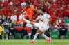 Morocco's Noussair Mazraoui (3) (center) gets a shot off in front of Netherlands' Denzel Dumfries (22) during the World Cup round of 32 soccer match between the Netherlands and Morocco in Guadalupe, near Monterrey, Mexico, Monday, June 29, 2026. (AP Photo/Addison Simmons)
