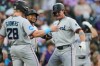 From left to right, Miami Marlins' Kyle Stowers and Xavier Edwards congratulate pinch hitter Griffin Conine after Conine's three-run home run off Colorado Rockies relief pitcher Victor Vodnik in the fifth inning of a baseball game Monday, June 29, 2026, in Denver. (AP Photo/David Zalubowski)
