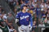 Los Angeles Dodgers' Shohei Ohtani, right, watches his three-run home run during the sixth inning of a baseball game against the Athletics, Monday, June 29, 2026, in West Sacramento, Calif. (AP Photo/Sara Nevis)