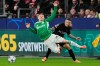 FILE - Leverkusen's Alejandro Grimaldo, right, and Newcastle's Harvey Barnes fight for the ball during the Champions League opening phase soccer match between Bayer Leverkusen and Newcastle United in Leverkusen, Germany, Dec. 10, 2025. (AP Photo/Martin Meissner, File)