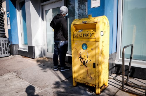 A man waits to enter the Safeworks supervised consumption site at the Sheldon M. Chumir Health Centre in Calgary, Alta., Thursday, Aug. 26, 2021.THE CANADIAN PRESS/Jeff McIntosh