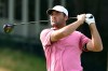 Scottie Scheffler tees off the first playoff hole of the Travelers Championship golf tournament at TPC River Highlands, Monday, June 29, 2026, in Cromwell, Conn. (AP Photo/Jessica Hill)