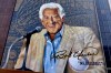 This 80-foot by 100-foot mural posthumously honoring longtime Milwaukee Brewers broadcaster Bob Uecker was dedicated Tuesday, June 30, 2026 in Milwaukee. (AP Photo/Steve Megargee)