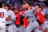 Washington Nationals' Cade Cavalli, front right, is held back as tempers flare during the fourth inning of a baseball game against the Boston Red Sox, Tuesday, June 30, 2026, in Boston. (AP Photo/Charles Krupa)