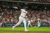 Houston Astros' Yordan Alvarez celebrates after hitting a grand slam against the Minnesota Twins during the fourth inning of a baseball game Tuesday, June 30, 2026, in Houston. (AP Photo/David J. Phillip)
