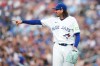 Toronto Blue Jays pitcher Kevin Gausman (34) gestures to a teammate against the New York Mets during first inning MLB baseball action in Toronto on Tuesday, June 30, 2026. THE CANADIAN PRESS/Nathan Denette