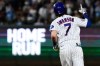 Chicago Cubs' Dansby Swanson celebrates as he rounds the bases after hitting a two-run home run during the fifth inning of a baseball game against the San Diego Padres in Chicago, Tuesday, June 30, 2026. (AP Photo/Nam Y. Huh)
