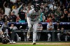 Miami Marlins' Joe Mack begins rounding the bases after hitting a home run in the seventh inning of a baseball game against the Colorado Rockies Tuesday, June 30, 2026, in Denver. (AP Photo/Geneva Heffernan)