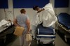 A nurse prepares a bed at the emergency department of the Paris-Saclay Hospital, outside Paris, Tuesday June 30, 2026. (AP Photo/Christophe Ena )