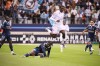 Metz's Brian Madjo, centre, and Paris FC's Jean-Philippe Krasso, bottom, in action during the League One soccer match between Paris FC and Metz at the Jean-Bouin stadium, in Paris, France, on Aug. 31, 2025. (AP Photo/Thomas Padilla, File)