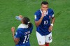 France's Kylian Mbappe (10) and France's Michael Olise (11) drink during a hydration break during the World Cup round of 32 soccer match between France and Sweden in East Rutherford, N.J., near New York, Tuesday, June 30, 2026. (AP Photo/Yuki Iwamura)