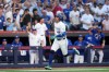 Toronto Blue Jays designated hitter George Springer (4) runs home after hitting a triple on an in-field home run after a fielding error by New York Mets' A.J. Ewing during first inning American League MLB baseball action in Toronto, Monday, June 29, 2026. THE CANADIAN PRESS/Nathan Denette