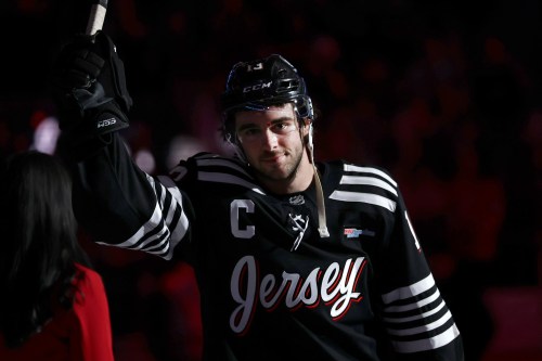 FILE - New Jersey Devils center Nico Hischier gestures after overtime of an NHL hockey game against the Ottawa Senators, April 12, 2026, in Newark, N.J. (AP Photo/Adam Hunger, File)