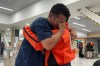 German Bello, right, a volunteer with the Mexican search-and-rescue brigade Los Topos Azteca, embraces a Venezuelan man who approached the team to thank them as they departed for Venezuela from Mexico City's airport, Tuesday, June 30, 2026. (AP Photo/Fernanda Pesce)