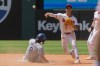 Cleveland Guardians' Brayan Rocchio, right forces Texas Rangers Josh Smith at second base but his throw to first was not in time to complete a double play during the sixth inning of a baseball game, Wednesday, July 1, 2026, in Cleveland. (AP Photo/Phil Long)