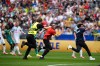 A security guard try to catch pitch invaders during the World Cup round of 32 soccer match between Belgium and Senegal in Seattle, Wednesday, July 1, 2026. (AP Photo/Lindsey Wasson)