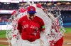 Toronto Blue Jays' Sean Keys (20) is doused by teammates after defeating the New York Mets in MLB baseball action in Toronto on Wednesday, July 1, 2026. THE CANADIAN PRESS/Frank Gunn