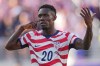 United States' Folarin Balogun (20) reacts after scoring his team's first goal during the World Cup round of 32 soccer match between the United States and Bosnia in Santa Clara, Calif., near San Francisco, Wednesday, July 1, 2026. (AP Photo/Julio Cortez)