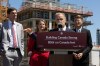 B.C. Premier David Eby (left), provincial Housing Minister Christine Boyle and federal Housing Minister Gregor Robertson (right) look on as Prime Minister Mark Carney makes an announcement at a construction site in Vancouver on Thursday, June 18, 2026. THE CANADIAN PRESS/Chad Hipolito