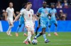 England's Elliot Anderson (8) passes the ball ahead of Congo's Yoane Wissa (20) during the World Cup round of 32 soccer match between England and Congo in Atlanta, Wednesday, July 1, 2026. (AP Photo/Butch Dill)