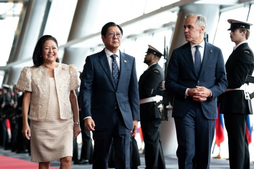 Prime Minister Mark Carney walks with Philippine President Ferdinand Marcos Jr., centre, and First Lady Louise Araneta-Marcos, left, before a meeting in Vancouver, on Thursday, July 2, 2026. THE CANADIAN PRESS/Ethan Cairns