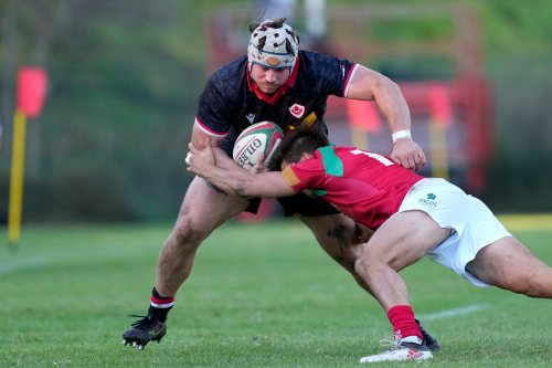 Portugal's Rodrigo Marta tackles Canada's Andrew Quattrin, left, during a rugby union international match between Portugal and Canada in Oeiras, outside Lisbon, Saturday, Nov. 6, 2021. (AP Photo/Armando Franca)