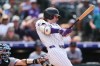 Colorado Rockies' Jake McCarthy hits a two-run single off Miami Marlins relief pitcher Calvin Faucher in the sixth inning of a baseball game Thursday, July 2, 2026, in Denver. (AP Photo/David Zalubowski)