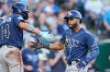 Tampa Bay Rays' Cedric Mullins, right, celebrates with Chandler Simpson (14) after hitting a two-run home run during the fifth inning of a baseball game against the Kansas City Royals, Thursday, July 2, 2026, in Kansas City, Mo. (AP Photo/Charlie Riedel)