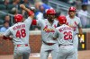 St. Louis Cardinals' Jordan Walker, center, reacts with Iván Herrera (48) and JJ Wetherholt (26) after hitting a three-run home run in the first inning of a baseball game against the Atlanta Braves, Thursday, July 2, 2026, in Atlanta. (AP Photo/Colin Hubbard)