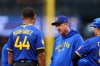 Seattle Mariners manager Dan Wilson exchanges words with Julio Rodríguez after being hit by the ball in the first inning of a baseball game against the Los Angeles Angels, Thursday, July 2, 2026, in Seattle. (AP Photo/Kevin Ng)